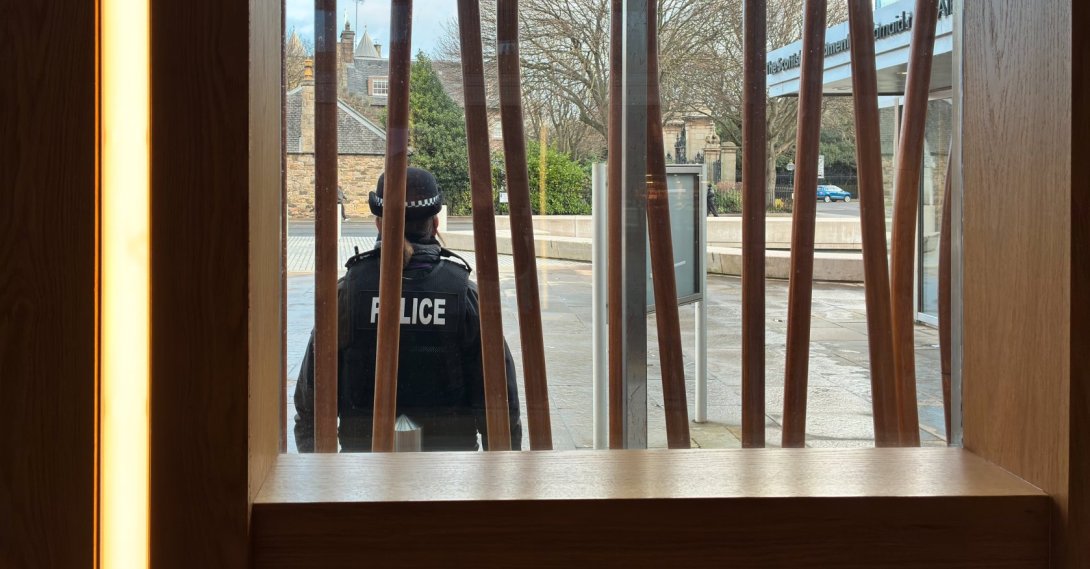 A police officer stands in front of the Scottish Parliament Building, in Edinburgh, Scotland, U.K., Dec. 19, 2025. (Getty Images Photo)