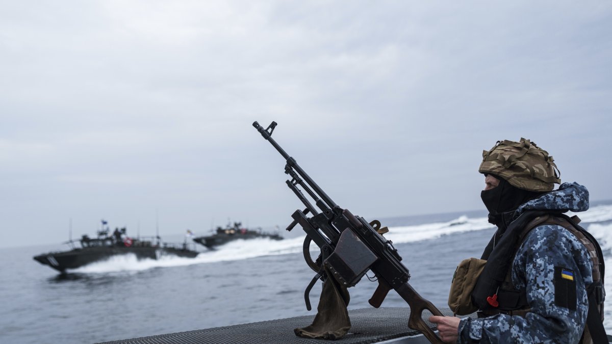A Ukrainian serviceman of Military Naval Forces stands on a boat during patrol over Black Sea coast line of Odesa region, Ukraine, March 27, 2025. (AP Photo)