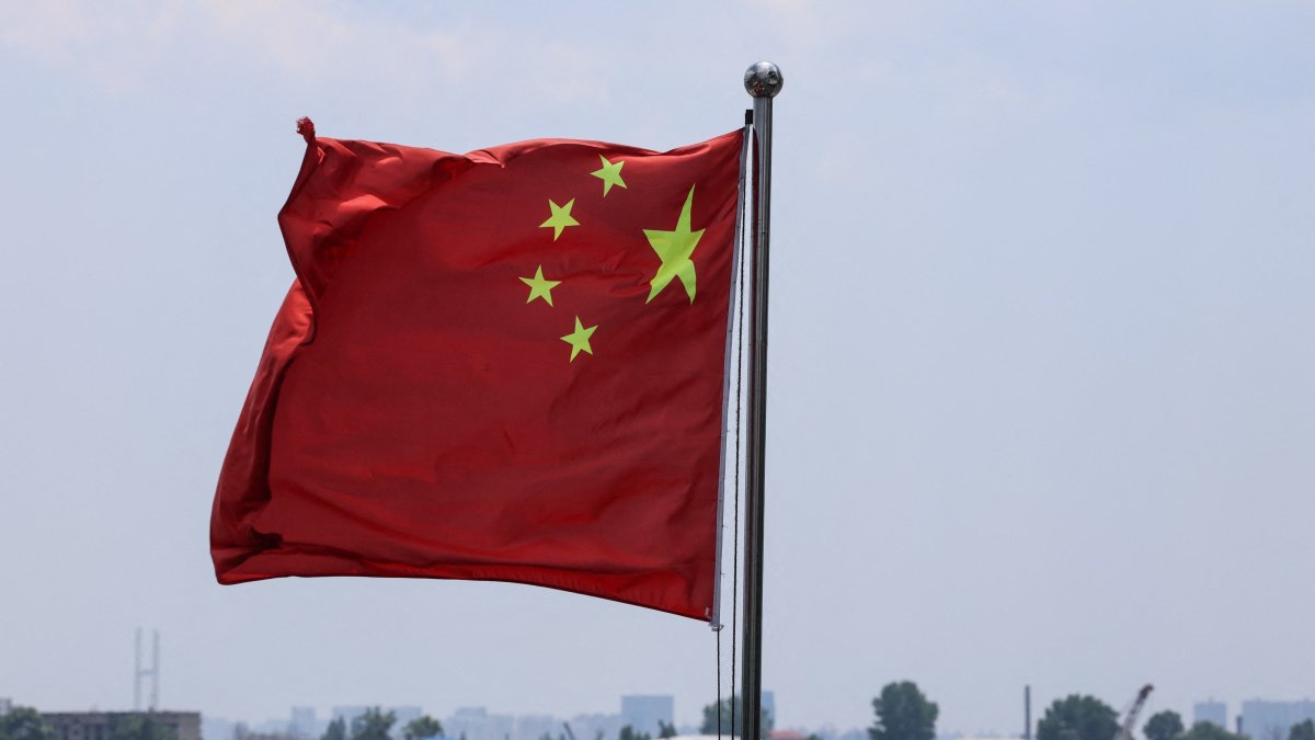 The Chinese national flag flies in the wind over the Yalu River, with buildings of the North Korean city of Sinuiju behind, on the bank across, in Dandong, Liaoning province, China, June 8, 2026. (Reuters Photo)