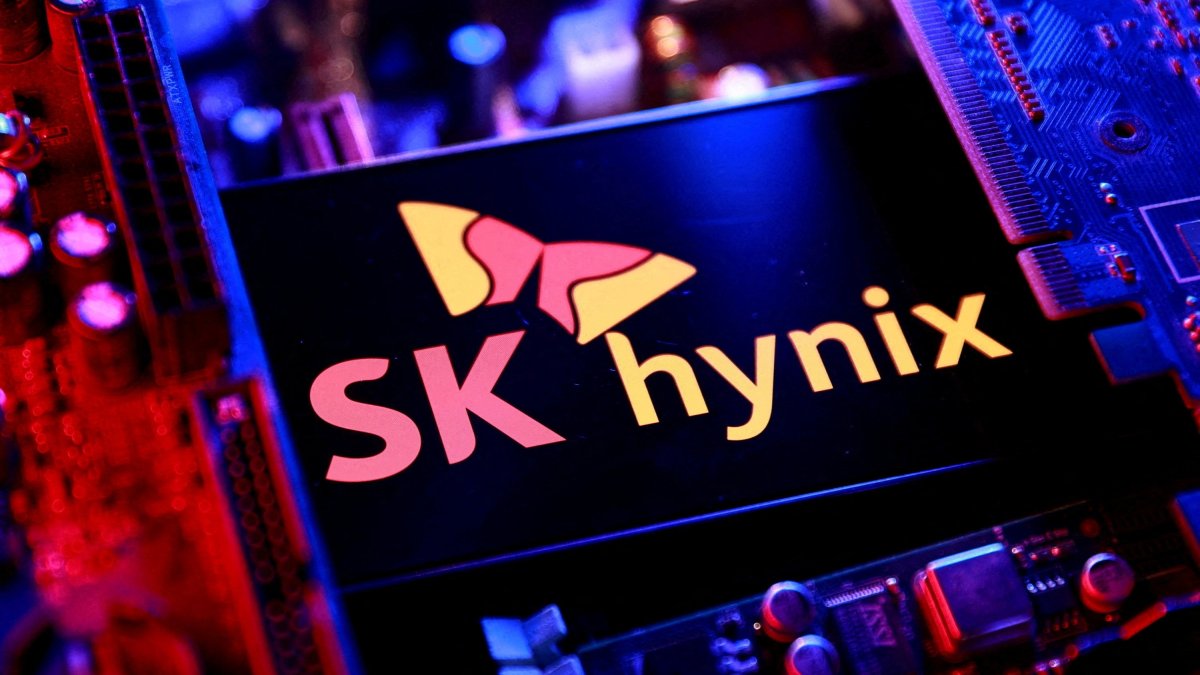 The SK Hynix logo and a computer motherboard appear in this illustration taken Aug. 25, 2025. (Reuters Photo)