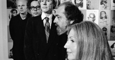 Art collectors Ethel and Robert Scull posing with, artist Andy Warhol, sculptor George Segal, and painter James Rosenquist at the Sculls’ residence in 1973. (Getty Images Photo)