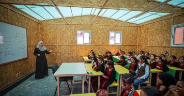 Students attend a lesson at the Abu Bakr Temporary School, established by Türkiye's Humanitarian Relief Foundation (IHH,) Gaza Strip, Palestine, June 22, 2026. (AA Photo)