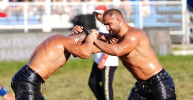 Feyzullah Aktürk (R) in action during the Yuntdağı Oil Wrestling tournament, a key stage of the CW Enerji Türkiye Oil Wrestling League organized by the Manisa Metropolitan Municipality, Manisa, Türkiye, June 7, 2026. (IHA Photo)