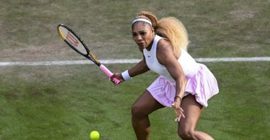 Serena Williams plays a forehand next to Karolina Muchova during a first-round women's doubles tennis match against Erin Routliffe and Giuliana Olmos, Berlin, Germany, June 16, 2026. (AP Photo)