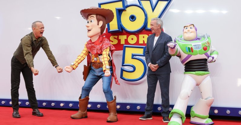 Tom Hanks (L) and Tim Allen (R) pose for photographers with people costumed as the characters Woody and Buzz Lightyear at a launch event for "Toy Story 5," London, U.K., May 28, 2026. (AP Photo)