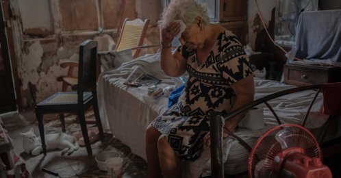 Margarita Salazar, 82, wipes the sweat off with a tissue inside her home amid hot weather in Veracruz, Mexico, June 16, 2024. (AP Photo)