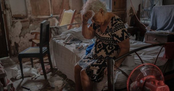Margarita Salazar, 82, wipes the sweat off with a tissue inside her home amid hot weather in Veracruz, Mexico, June 16, 2024. (AP Photo)