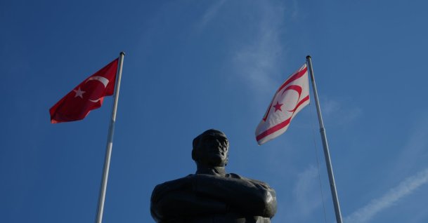 Turkish and Turkish Republic of Northern Cyprus (TRNC) flags are seen with a statue of Mustafa Kemal Atatürk, Nicosia (Lefkoşa), island of Cyprus, Oct. 17, 2025. (AP File Photo)