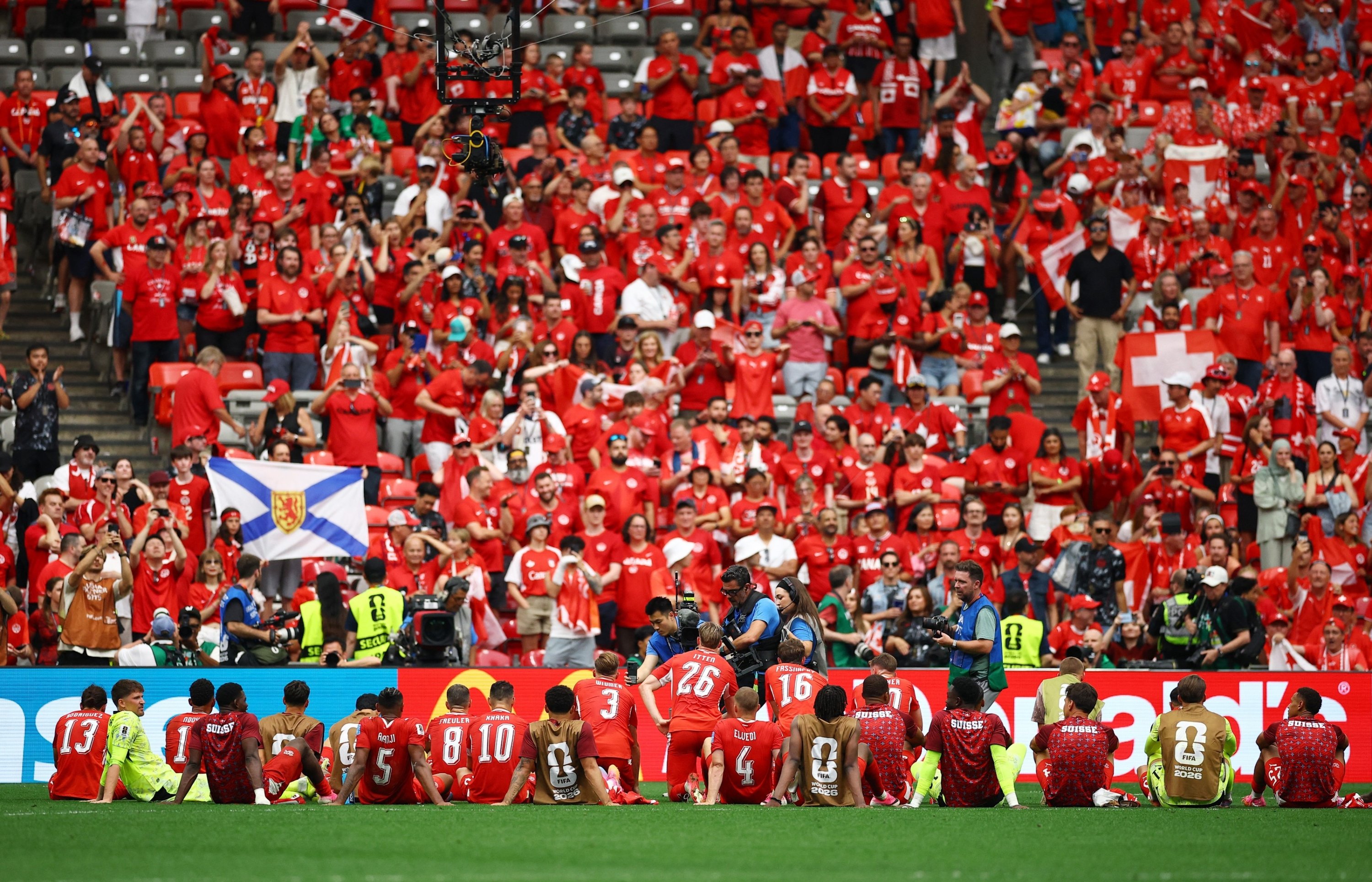Switzerland tops Group B as Canada reaches historic knockout stage