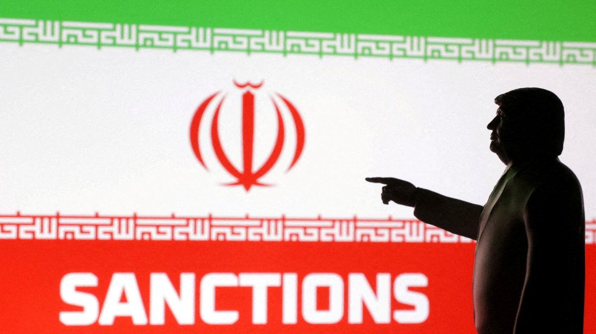 A 3D-printed miniature model depicts U.S. President Donald Trump, the Iranian flag and the word "Sanctions" in this illustration created on April 17, 2025. (Reuters Photo)