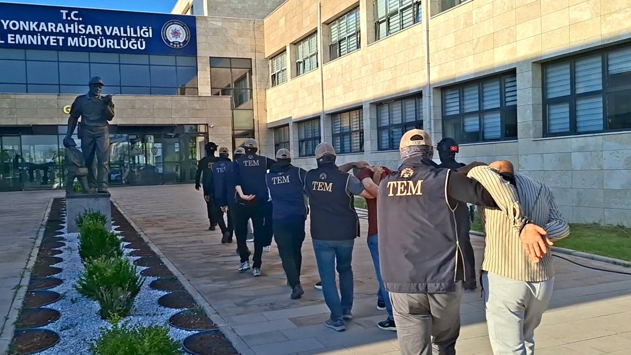 Security officers escort suspects detained in an operation targeting the Daesh terrorist group, Afyonkarahisar, Türkiye, June 24, 2026. (AA Photo)