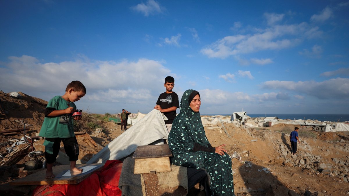 Palestinians inspect the site of an Israeli strike on a tent camp sheltering displaced people, who were warned to evacuate before the attack, Gaza City, Palestine, June 24, 2026. (Reuters Photo)