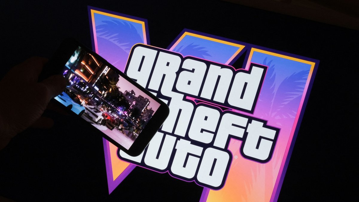 This illustration shows Rockstar Games’ Grand Theft Auto VI trailer played on a screen in front of the game title, Los Angeles, U.S., Dec. 4, 2023. (AFP Photo)