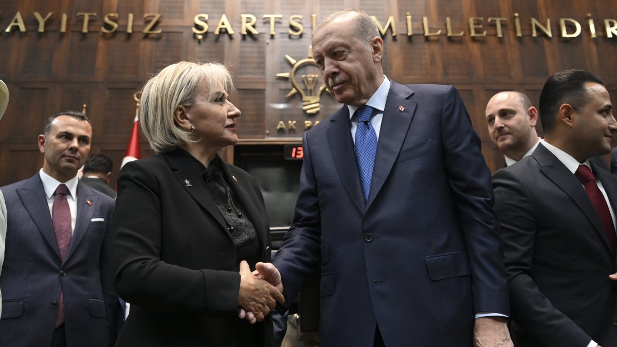 President Recep Tayyip Erdoğan shakes hands with Nimet Özdemir at the parliamentary group meeting of the AK Party, Ankara, Türkiye, June 24, 2026. (AA Photo)