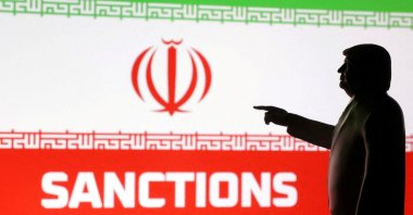 A 3D-printed miniature model depicts U.S. President Donald Trump, the Iranian flag and the word "Sanctions" in this illustration created on April 17, 2025. (Reuters Photo)
