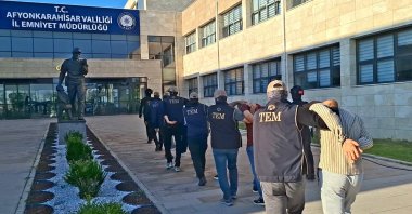 Security officers escort suspects detained in an operation targeting the Daesh terrorist group, Afyonkarahisar, Türkiye, June 24, 2026. (AA Photo)