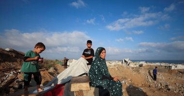 Palestinians inspect the site of an Israeli strike on a tent camp sheltering displaced people, who were warned to evacuate before the attack, Gaza City, Palestine, June 24, 2026. (Reuters Photo)