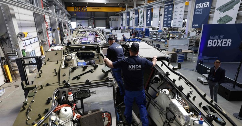 Employees work at a new production line of Boxer 8x8 wheeled armored personnel carriers produced by pan-European defense company KNDS, Munich, Germany, April 22, 2026. (AFP Photo)