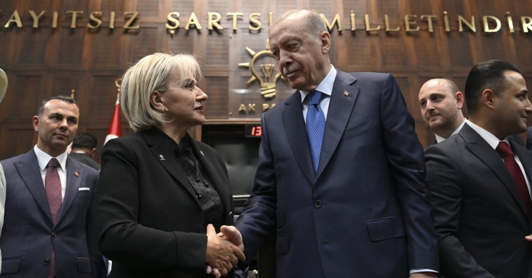 President Recep Tayyip Erdoğan shakes hands with Nimet Özdemir at the parliamentary group meeting of the AK Party, Ankara, Türkiye, June 24, 2026. (AA Photo)