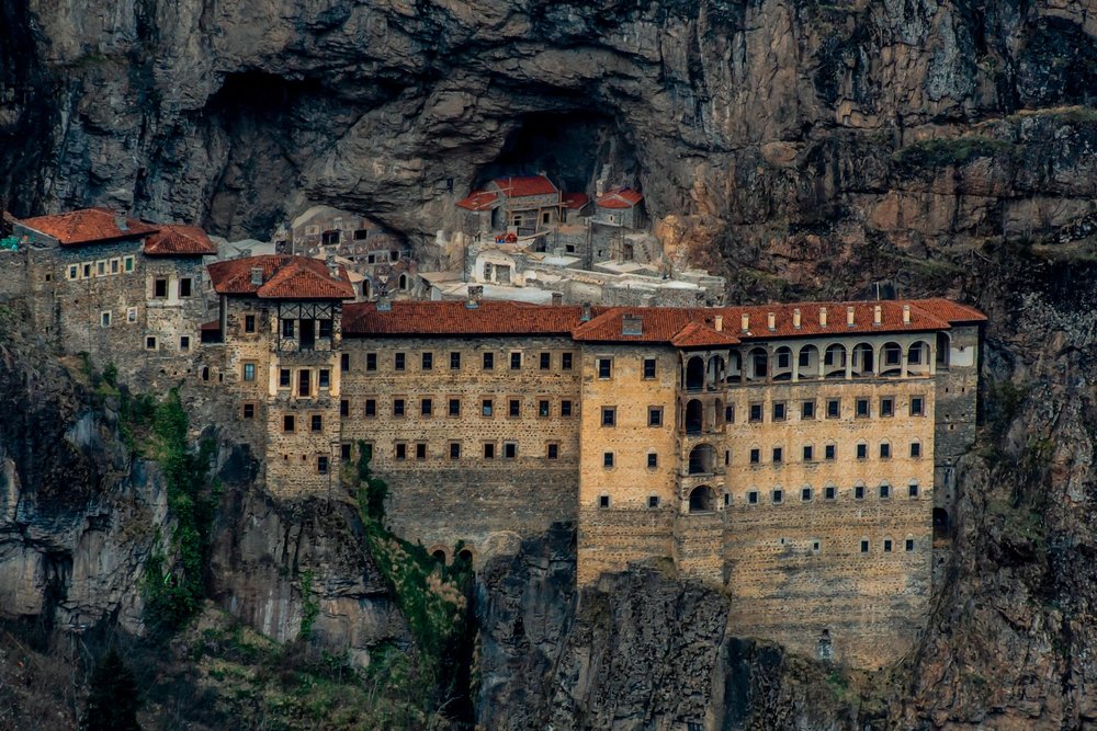 A view of the ancient Sümela Monastery, located at a 1200 meters height on the steep cliff, Trabzon, Türkiye. (Shutterstock Photo)