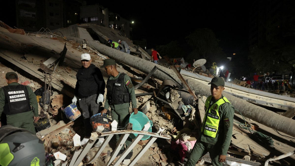 Emergency services work at the site of a collapsed building after an earthquake, Caracas, Venezuela, June 24, 2026. (Reuters Photo)