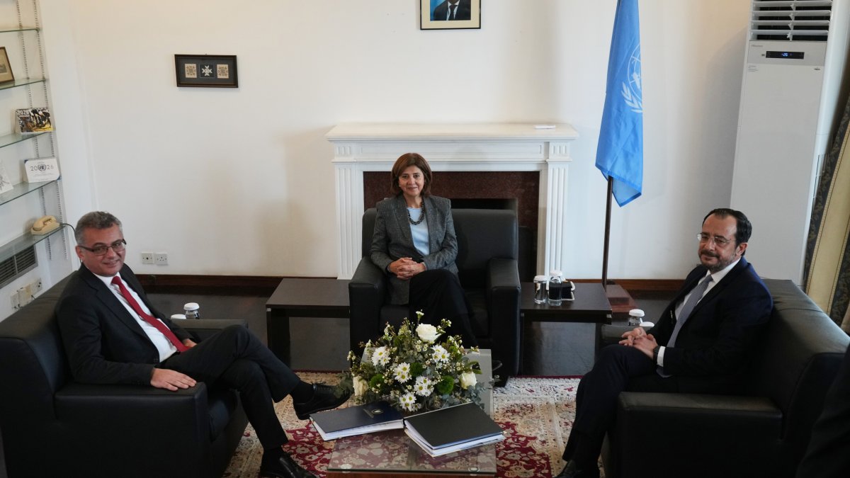 Greek Cypriot leader Nikos Christodoulides (R) and Turkish Cypriot leader Tufan Erhürman (L) meet U.N. special envoy Maria Angela Holguin Cuellar, Lefkoşa (Nicosia), Cyprus, Jan. 28, 2026. (AP Photo)
