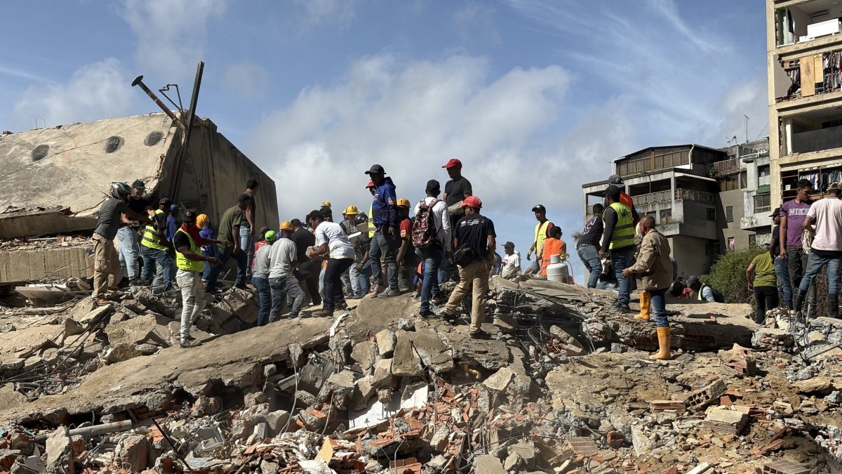 Resuce workers search debris from buildings that collapsed in the earthquakes in the San Bernardino neighborhood of Caracas, Venezuela, June 25, 2026. (EPA Photo)