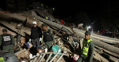 Emergency services work at the site of a collapsed building after an earthquake, Caracas, Venezuela, June 24, 2026. (Reuters Photo)