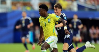 Brazil's Vinicius Junior in action with Scotland's Jack Hendry during the 2026 FIFA World Cup Group C match at Miami Stadium, Miami Gardens, U.S., June 24, 2026. (Reuters Photo)