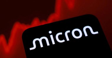 The Micron logo and a rising stock graph are seen in this illustration taken, June 11, 2026. (Reuters Photo)