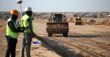 Port workers are seen on the construction site of the Grand Faw Port docks, Basra, southern Iraq, Nov. 6, 2024. (AFP Photo)