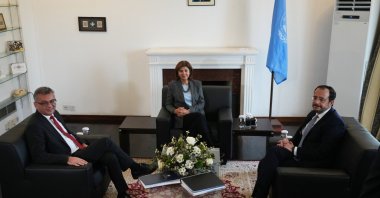 Greek Cypriot leader Nikos Christodoulides (R) and Turkish Cypriot leader Tufan Erhürman (L) meet U.N. special envoy Maria Angela Holguin Cuellar, Lefkoşa (Nicosia), Cyprus, Jan. 28, 2026. (AP Photo)