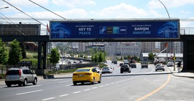 Billboards bearing the slogans "The Key to Peace," "The Key to Security" and "A Shared Future in Peace" are displayed along a protocol route, Ankara, Türkiye, June 25, 2026. (AA Photo)