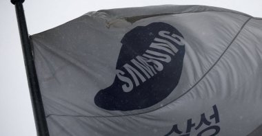 A flag bearing the logo of Samsung Electronics flutters as it rains in front of their office building in Seoul, South Korea, May 20, 2026. (Reuters Photo)
