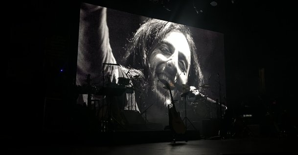 A portrait of legendary musician Kazım Koyuncu is displayed during a commemoration concert, Istanbul, Türkiye, June 20, 2026. (AA Photo)