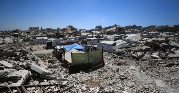 Palestinians shelter in tents amid the rubble of residential buildings destroyed during the Israeli offensive, in Gaza City, June 23, 2026. (Reuters Photo)