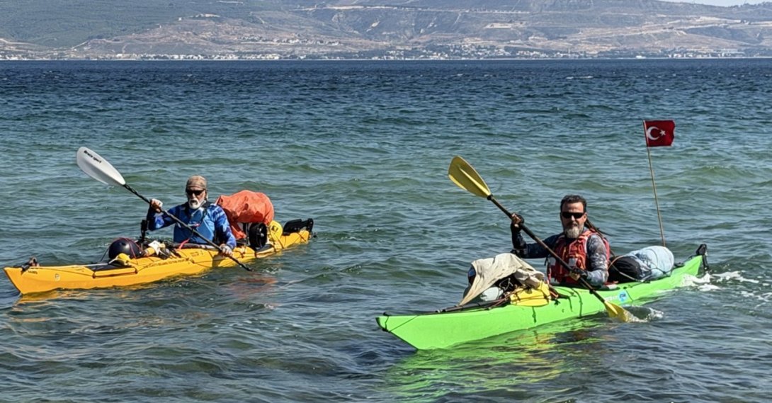 Kayakers Onur Çağlar and Halil Uzel paddle along the Çanakkale Strait during a coastal expedition to promote water sports, Çanakkale, Türkiye, June 25, 2026. (AA Photo)