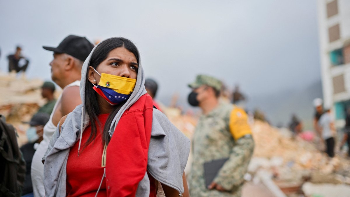 A woman looks on as rescue operations continue after earthquakes hit the country, in La Guaira, Venezuela, June 27, 2026. (Reuters Photo)