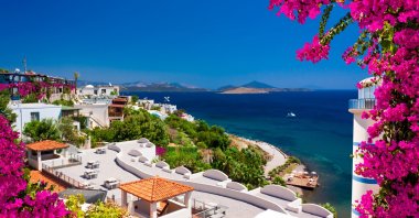 A view of Bodrum's coastline, with whitewashed homes and the Aegean Sea in the background, Muğla, Türkiye (Shutterstock Photo)