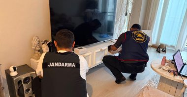 Security teams examine evidence during an operation targeting a credit card fraud ring, Istanbul, Türkiye, June 13, 2026. (AA Photo) 