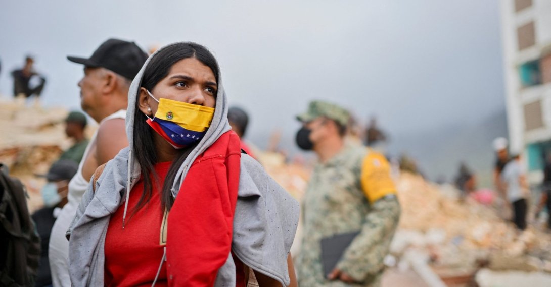 A woman looks on as rescue operations continue after earthquakes hit the country, in La Guaira, Venezuela, June 27, 2026. (Reuters Photo)