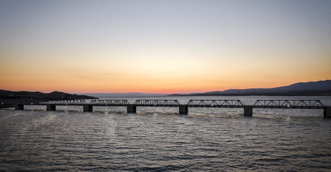 The Euphrates Railway Bridge is seen at sunset over Karakaya Dam Lake, Malatya, Türkiye, June 25, 2026. (AA Photo)