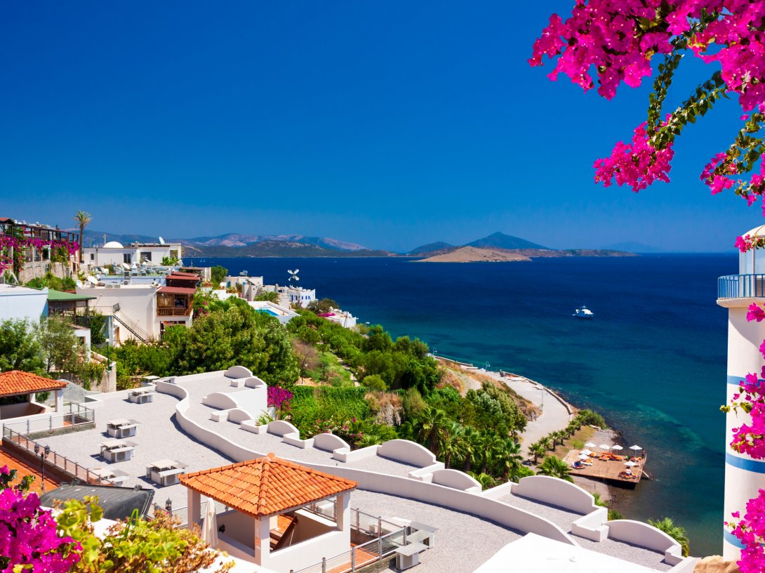 A view of Bodrum's coastline, with whitewashed homes and the Aegean Sea in the background, Muğla, Türkiye (Shutterstock Photo)