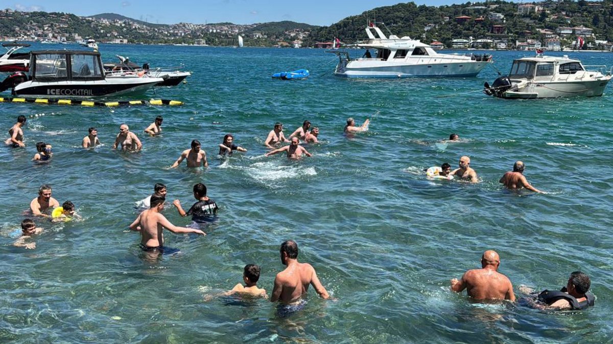 Residents cool off and swim the Bosporus during hot weather, Istanbul, Türkiye, June 28, 2026. (AA Photo)