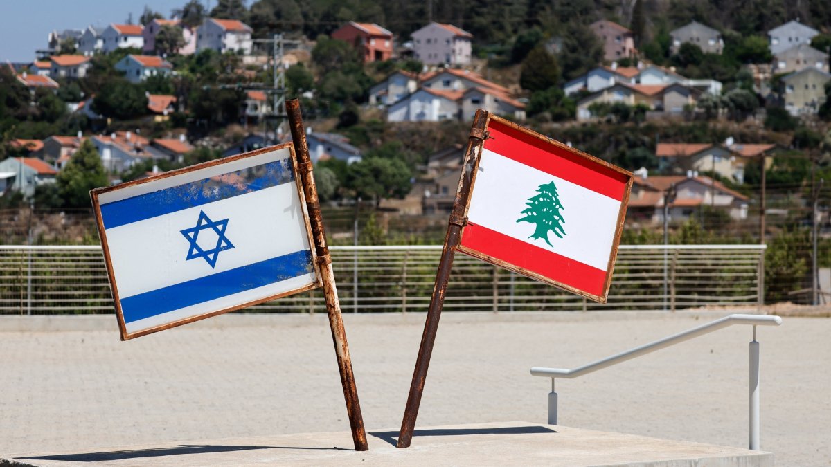Representations of the Israeli and Lebanese flags are seen at a memorial near the Israel-Lebanon border, June 27, 2026. (Reuters Photo)
