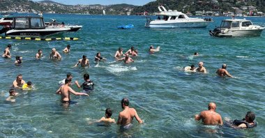 Residents cool off and swim the Bosporus during hot weather, Istanbul, Türkiye, June 28, 2026. (AA Photo)
