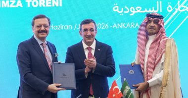 Vice President Cevdet Yılmaz (C), the Union of Chambers and Commodity Exchanges of Türkiye (TOBB) President Rifat Hisarcıklıoğlu (L) and the Federation of Saudi Chambers (FSC) Chair Abdullah bin Saleh Kamel pose after a signing ceremony, Ankara, Türkiye, June 28, 2026. (AA Photo)