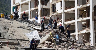Volunteers conduct search operations in a building damaged by an earthquake in La Guaira, Venezuela, June 29, 2026. (EPA Photo)