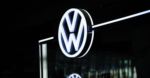 The illuminated VW logo is pictured in the customer center at the headquarters of German carmaker Volkswagen (VW) in Wolfsburg, Germany, Nov. 21, 2025. (AFP Photo)