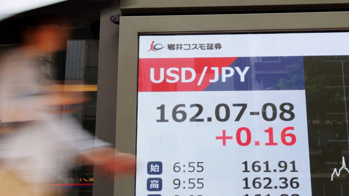 A passerby walks past a currency indicator board in Tokyo, Japan, June 30, 2026. (EPA Photo)